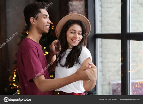 Attractive African American Couple Dancing Home — Stock Photo © belchonock #200798386