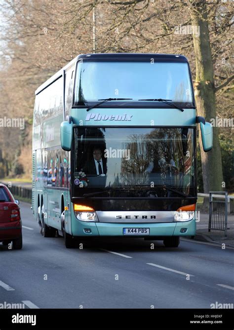 Status Quo band members arrive in their tour bus at Woking Crematorium ...