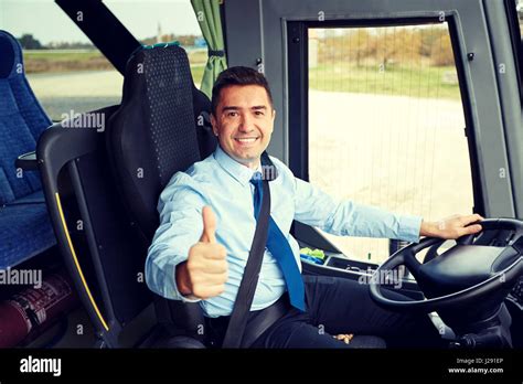 Smiling bus driver showing thumbs hi-res stock photography and images ...