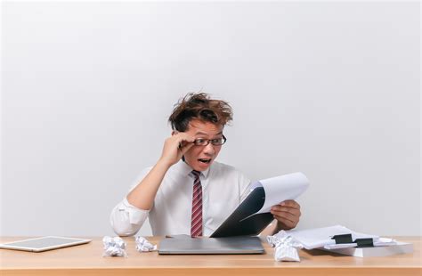 Asian business man sitting and working and stressed 8440279 Stock Photo at Vecteezy