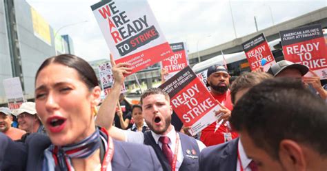 Flight attendants hold picket signs and rallies in protest for new ...