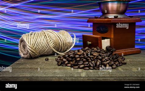 Rustic coffee set up on wooden table with lights trail Stock Photo - Alamy