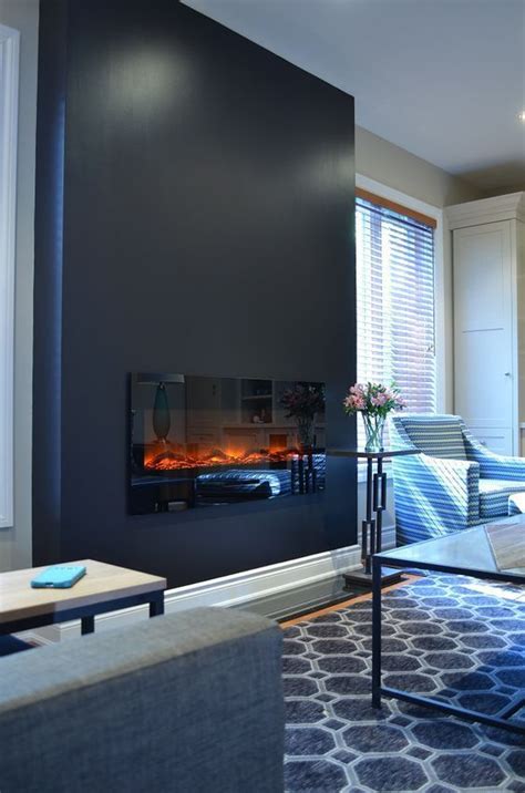 15 A Black Accent Wall With A Built In Fireplace For A Cozier Feel | Fireplace design, Modern ...