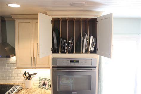 cookie sheet storage above my double ovens. Love! Sage House, Cabinetry, Kitchen Cabinets ...