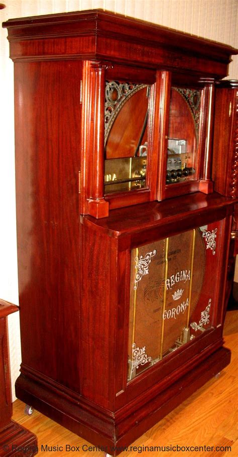 Regina Music Box Center: MAHOGANY REGINA ORCHESTRAL 27" AUTOMATIC CHANGER UPRIGHT DISC MUSIC BOX