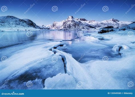 Mountain Ridge and Ice on the Frozen Lake Surface. Natural Landscape on the Lofoten Islands ...