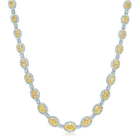 Oval Fancy Intense Yellow diamond necklace in platinum with white ...