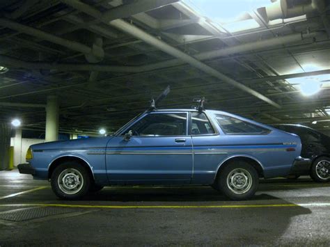 OLD PARKED CARS.: 1982 Datsun 210 Hatchback.