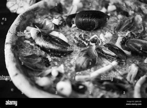 delicious italian pizza with fresh seafood Stock Photo - Alamy