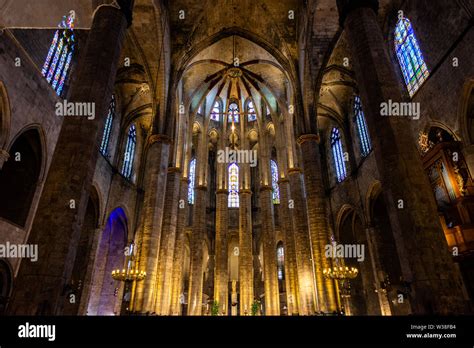 Interior of Santa Maria del Mar Basilica in typical Catalan Gothic style with pointed arches ...