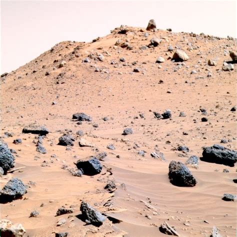 some rocks and dirt in the middle of a desert area with no one on it