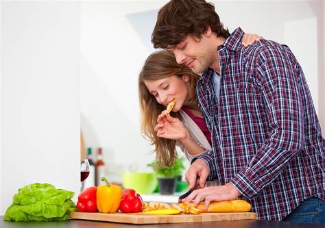 henglein & steets | fotografie | Couple cooking together in kitchen Photo