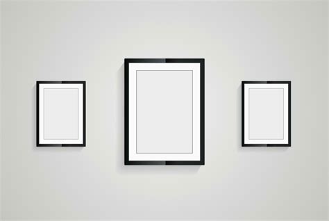 Three picture frames with black blank hanging on the whitewall for mock up design, vector black ...