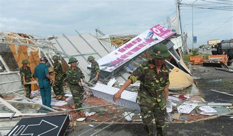 Houses flattened and businesses destroyed as Typhoon Doksuri tears through central Vietnam ...