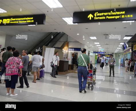 CHIANG MAI, THAILAND —MARCH 2018: Passengers head to the domestic and international departure ...