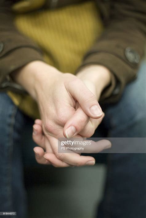 Clasped Hands High-Res Stock Photo - Getty Images