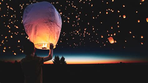 Download wallpaper: Lanterns floating on the night sky 1920x1080