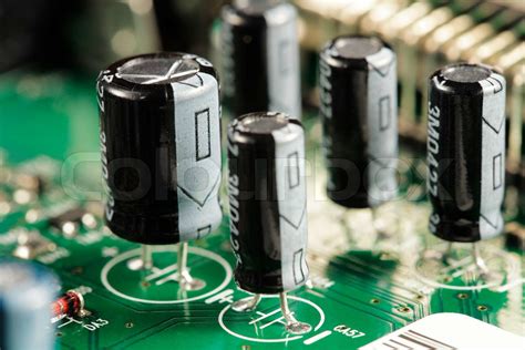 Capacitor electrical components on a circuit board | Stock image ...