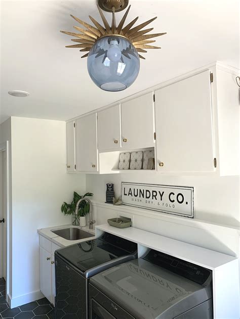 White, small, ,functional laundry area with top-loading machines | Small laundry rooms, Laundry ...