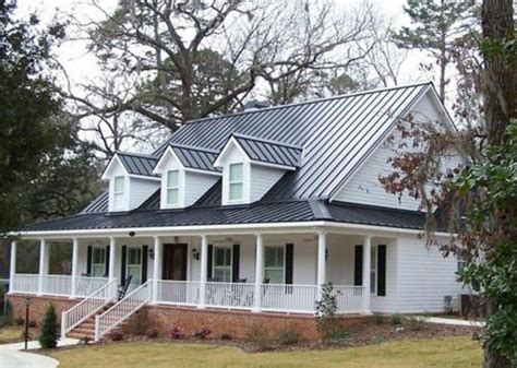 Dark tin roof on a white farm house with black shutters, big font porch, and brick | Farmhouse ...