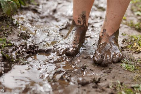 Feet in mud Stock Photo | Adobe Stock