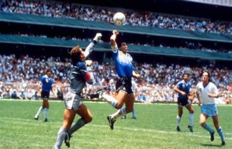 Diego Maradona scores a goal with his hand. - The 50 Most ...