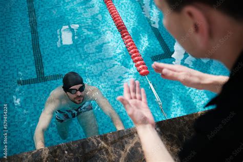 Swimming pool - swimmer training competition in class with coach Stock ...