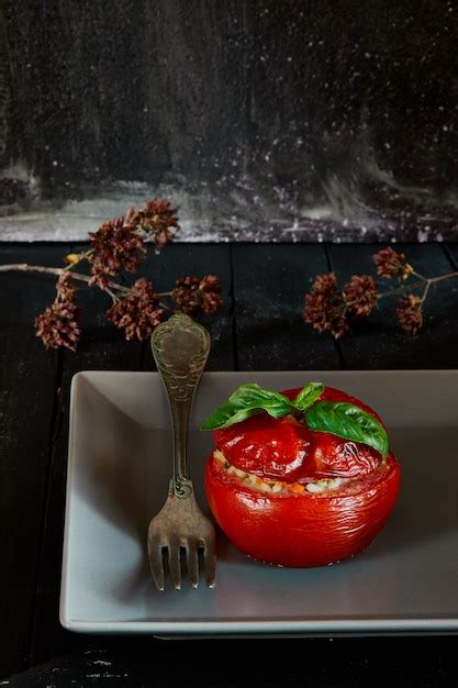 Premium Photo | Rice stuffed tomato meal