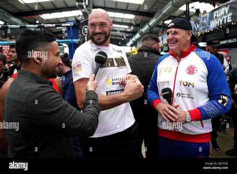 Tyson Fury (centre) and father John Fury (right) being interviewed by ...