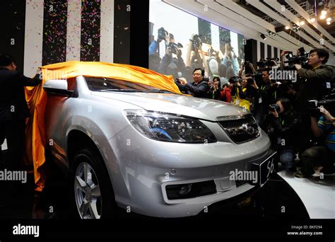 Wang Chuanfu, chairman of BYD, poses next a BYD S6 at the Beijing Auto Show. 23-Apr-2010 Stock ...