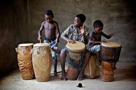 African boys beat drum | African music, African, Drums