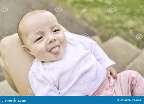 Baby is Lying Doing Grimace, Baby Make Faces Stock Image - Image of female, little: 199532907