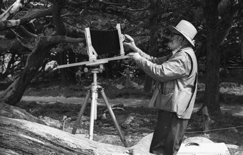 Ansel Adams Adjusting Camera | Photograph | Wisconsin Historical Society