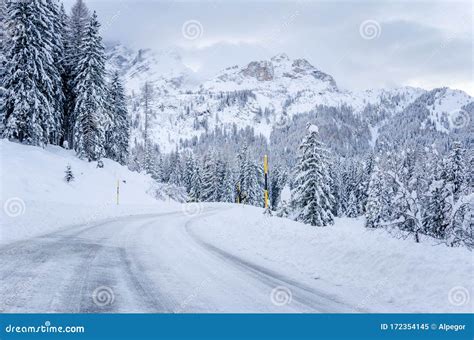 Icy Road in a Majestic Snowy Mountain Scenry on a Winter Day Stock Image - Image of conditions ...