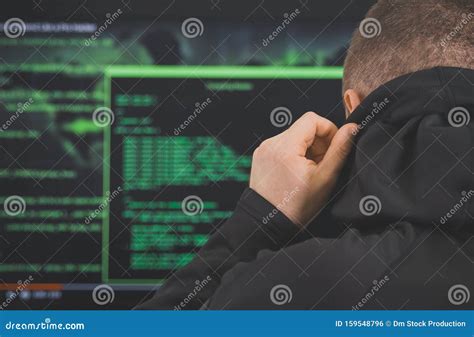 Hacker in black hoodie. stock photo. Image of crime - 159548796