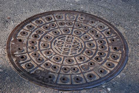 Con Ed Sewer Cap Photograph by Rob Hans