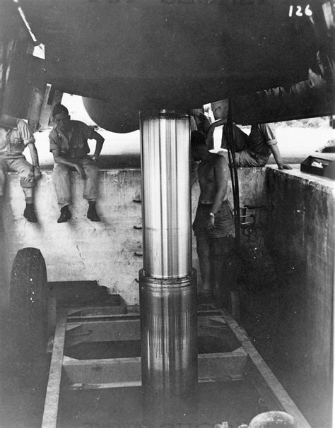 Loading 'Little Boy' bomb into B-29 bomber 'Enola Gay', Tinian, Mariana Islands, 6 Aug 1945 ...