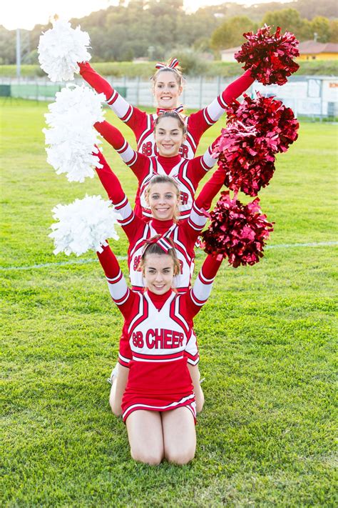 Group Of Cheerleaders In The Field | Cheer photography, Cheer poses, Cheer picture poses