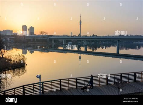 Vienna, sunset with Sahara dust, river Alte Donau (Old Danube), tower ...