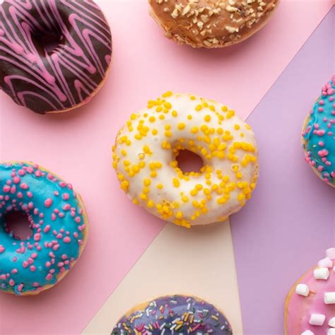 Free Photo | Colorful donuts with sprinkles close up