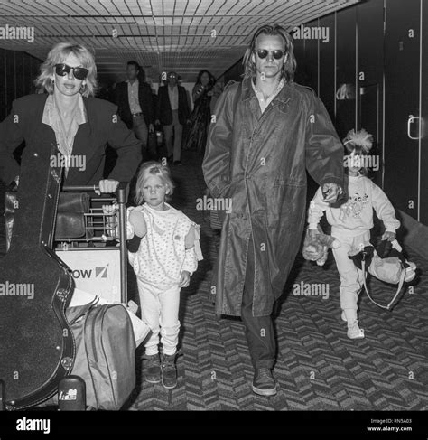 Rock singer Sting with wife Trudie Styler and children arriving at Heathrow Airport in 1984 ...