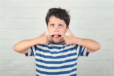 rude child making a grimace 6083949 Stock Photo at Vecteezy