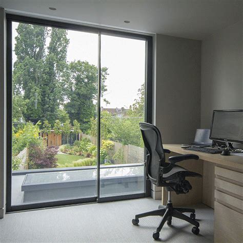 Sliding doors with hidden roller blinds in home office. | Blinds for windows living rooms ...
