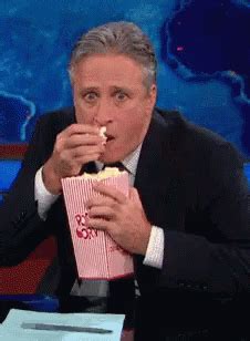 Eating Popcorn GIF - Eating Popcorn DailyShow - Discover & Share GIFs