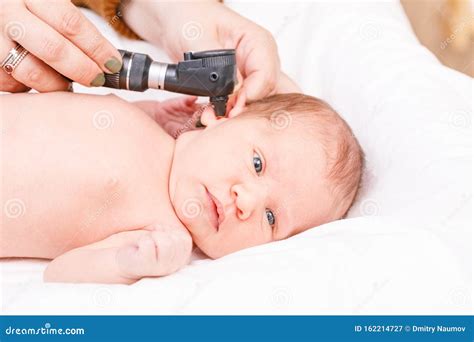 Newborn ENT Exam - Doctor Checking Ear with Otoscope in Pediatric Clinic Stock Image - Image of ...