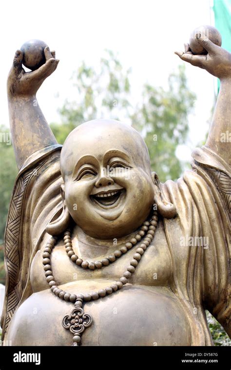 Statues of Chinese deity in smiling so happy Stock Photo - Alamy