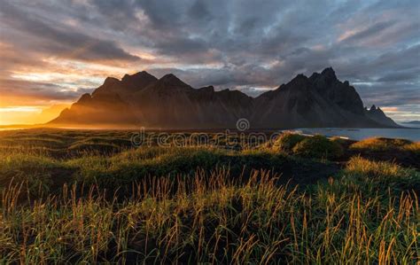 Beautiful Vestrahorn Mountain with a Sea and a Valley Under a Sunset Sky Stock Image - Image of ...