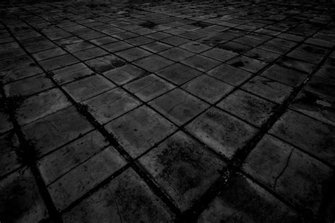 Premium Photo | Old black brick floor texture background.