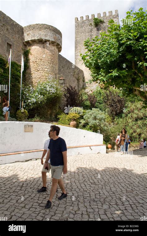 Obidos Castle walls and tower. Obidos is a very well preserved medieval town still inside castle ...