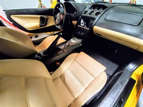 Lamborghini Gallardo Interior Pre-LP. Upgraded OEM infotainment system and buttons. Custom gold ...